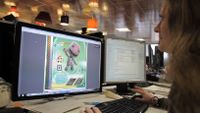 A student is working on a comuter for their game project.
