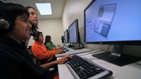 Students are working on the computer in their computer class.