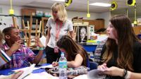 Teacher and students are working together in an afterschool class.