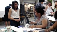Teacher and student are discussing about the student project.