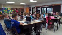 Students are working on computers.