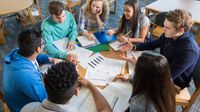 A group of high school students engaged in discussion