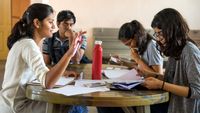 A small group of high school students engaged in discussion