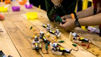 Students working on a STEAM project with circuits and knitting