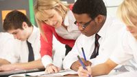 Teacher gives student one-on-one feedback