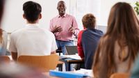 Administrator teaching a high school class