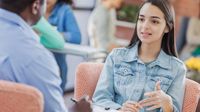 Student talking to a teacher