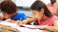 Two elementary students doing independent work in class