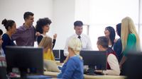 High school teacher facilitating a morning meeting with his students