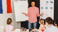 A French teacher instructing a class of middle school students