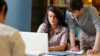 Two high school students give each other feedback on their essays