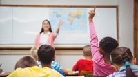 A teacher calling on a young girl in class