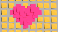 Heart made out of pink post-its surrounded by yellow post-its