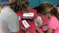 Two girls exploring with littleBits circuits