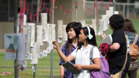 A photo of a group of students looking at the outdoor display.
