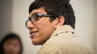 Photo of a young man listening attentively
