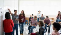 photo of a class looking at a whiteboard