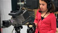 Young girl with video camera.
