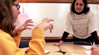 image of a teacher talking to a student