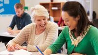 A young teacher seeks advice from a more experienced colleague.