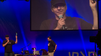 A photo of a speaker at the iPadalooza conference.
