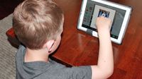 Boy watching a video on a tablet