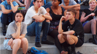 A photo of a group of teens hanging out.