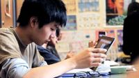Boy in class using a tablet