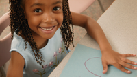 A photo of an elementary-school girl practicing writing.
