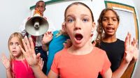 Teacher with blow horn and students with raised hands