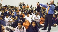 Animated principal, speaking to student body in gymnasium