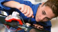 Girl working on an automobile