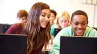 Two students discuss a computer game.