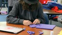 Student working on a puppet