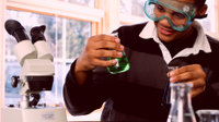 A photo of a high school student working in a chemistry lab.