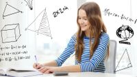 Photo of a student working on her math assignment, with diagrams and formulas written on the photo