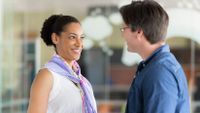 A teacher and a parent meet at a cafe.