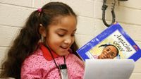 Young girl reading a book