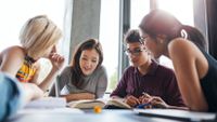 Students of different ethnicities work together in a group.