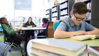 Students read in a school library.