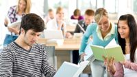 High school students read novels in class.