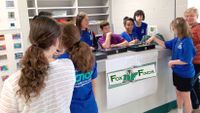 A team of students manages a school store together.