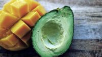 Orange cheese and half of an avocado