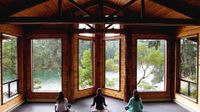 photo of three students looking out into a landscape