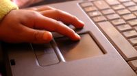 photo of student using a laptop computer