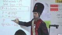 Teacher is in a solider costume teaching in front of a classroom