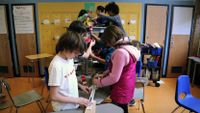 Students working on a Rubic Goldberg machine