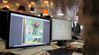 A student is working on a comuter for their game project.