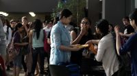High School students are gathering infront of the school.