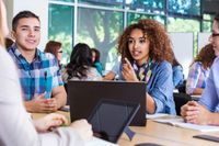 A group of high school students having a discussion in class